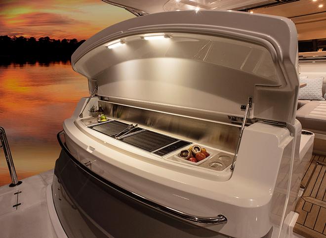 Integrated and self-contained BBQ into the coaming of the transom. - Riviera 4800 Sport Yacht © Riviera Australia